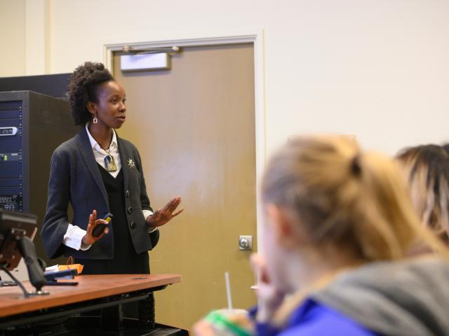 Assistant professor Maureen Kinyua talks to students about principles they should be watching for during Biological Principles of Environmental Engineering class